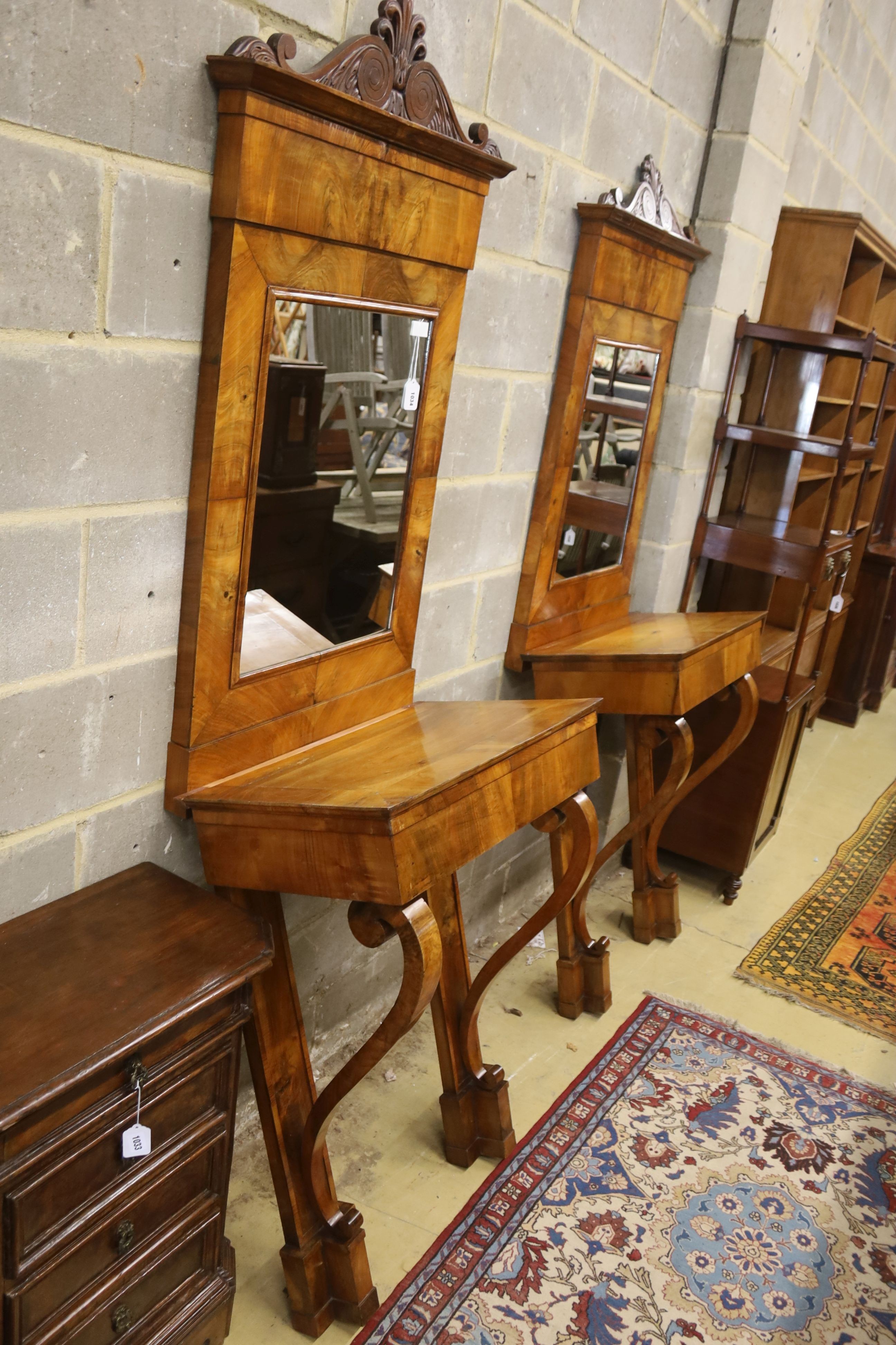 A pair of 19th century Italian mahogany pier tables with mirrors, width 72cm, depth 42cm, height 218cm